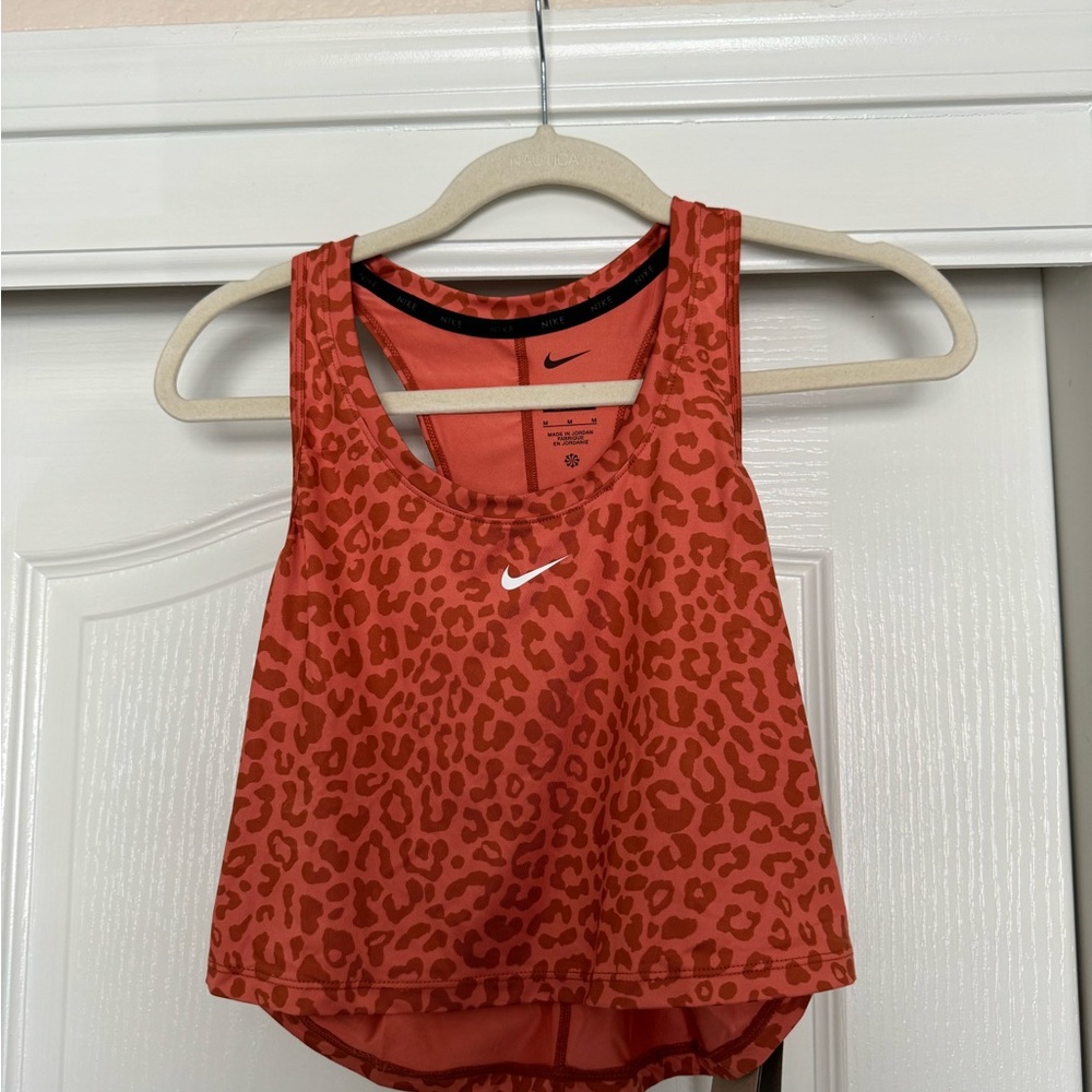 Nike cropped cheetah workout top in burnt orange